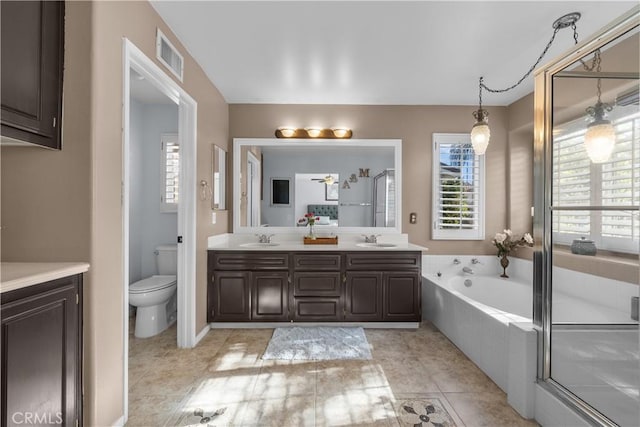 full bathroom with toilet, vanity, tile patterned flooring, and plus walk in shower