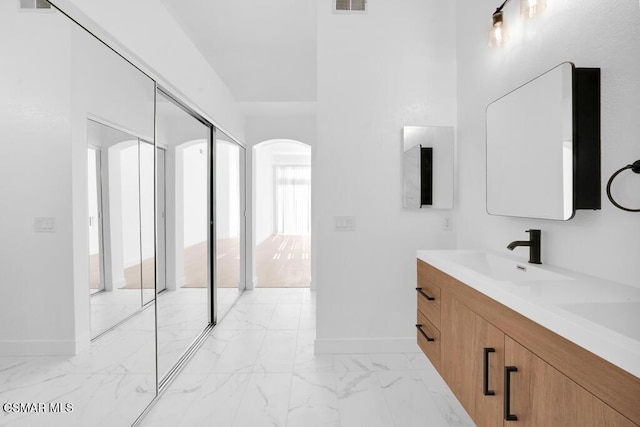 bathroom featuring vanity and plenty of natural light