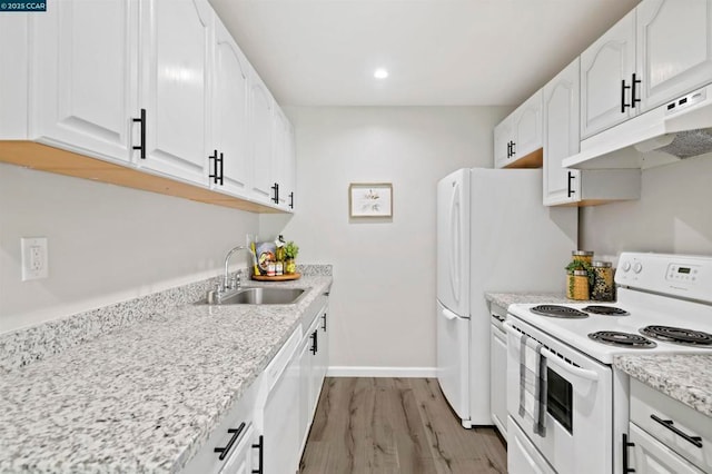 kitchen featuring light hardwood / wood-style floors, sink, white appliances, and white cabinets