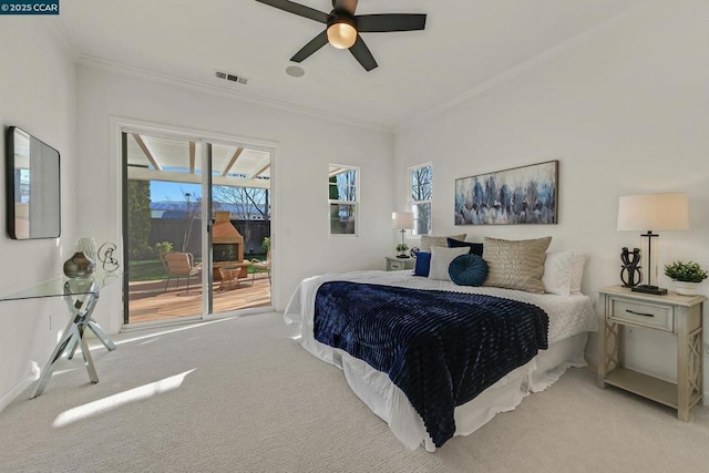 bedroom featuring ceiling fan, access to exterior, light colored carpet, and crown molding