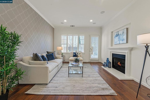 living room featuring dark wood-type flooring and ornamental molding