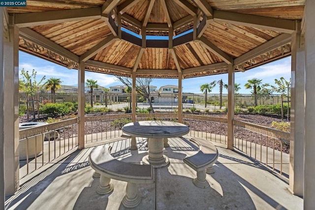 sunroom / solarium featuring lofted ceiling