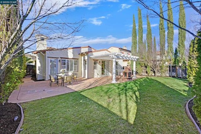 rear view of house with a yard, a patio, and a pergola