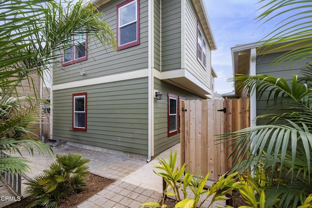 view of property exterior with a patio