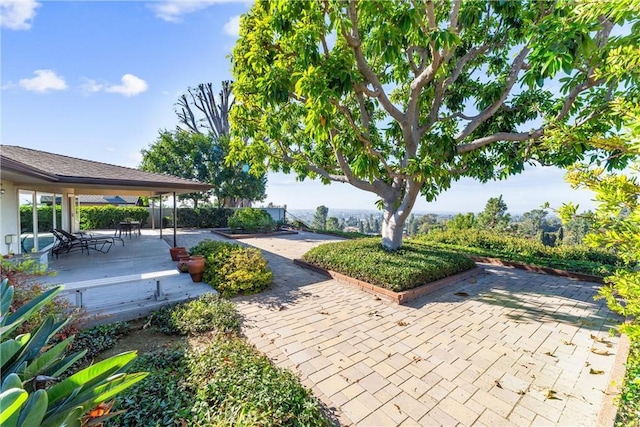 view of property's community featuring a patio area