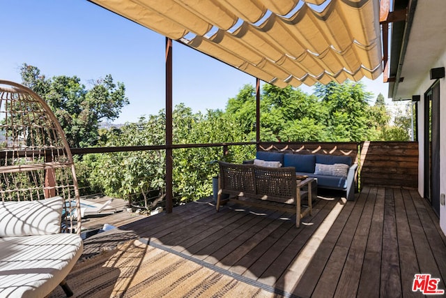 deck with an outdoor living space and a pergola