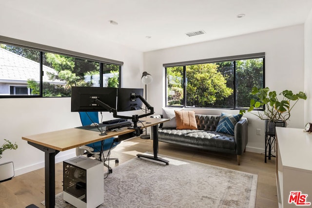 office space with light wood-type flooring