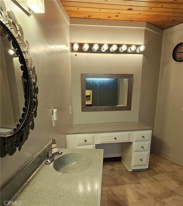 bathroom featuring vanity and wood ceiling