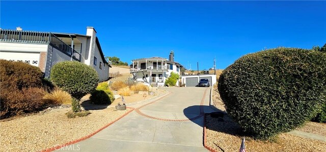 view of side of property featuring a balcony