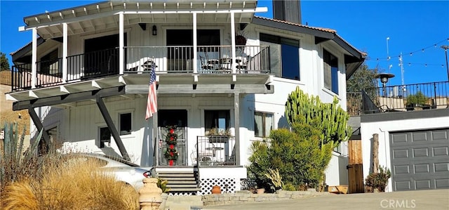 view of front of home with a balcony and a porch