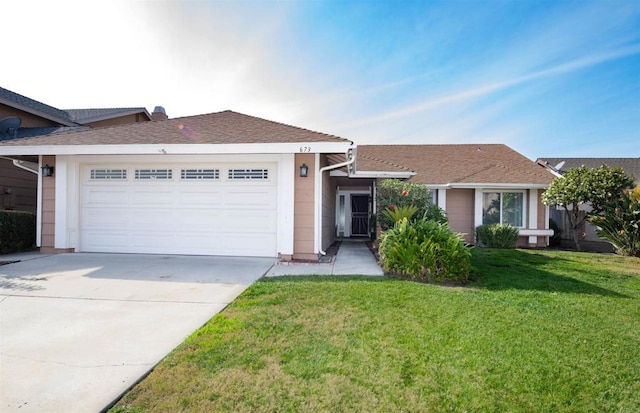 ranch-style home featuring a front lawn and a garage