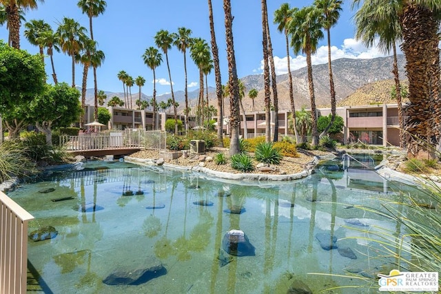 view of swimming pool featuring a mountain view