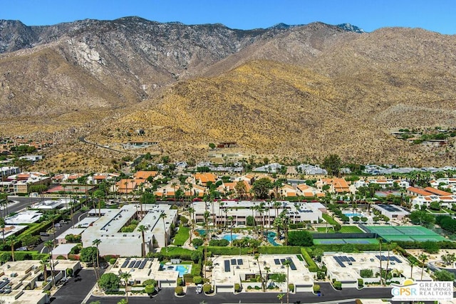 birds eye view of property featuring a mountain view