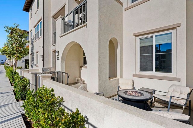 view of patio with a balcony