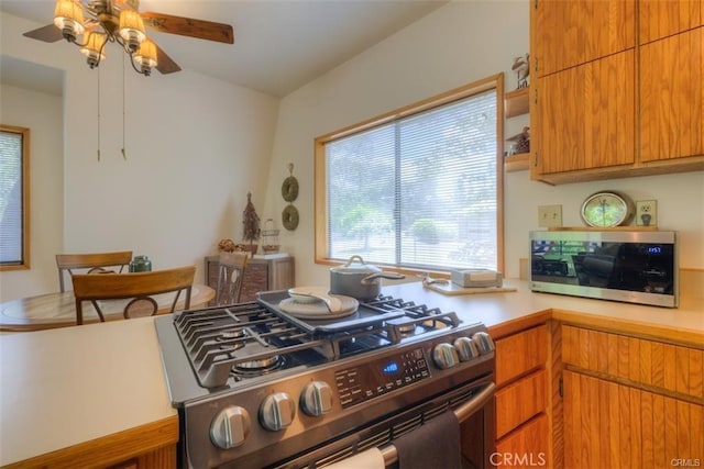 kitchen with ceiling fan and stainless steel appliances