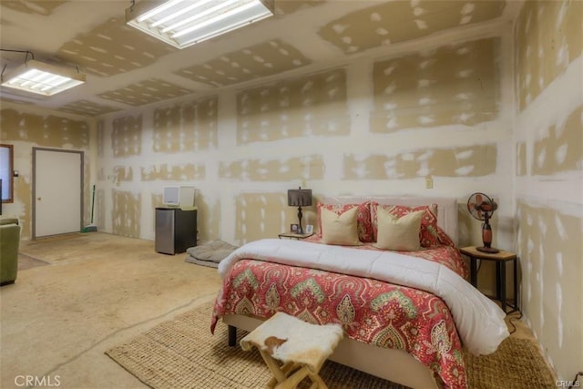 bedroom featuring concrete flooring