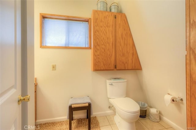 bathroom featuring toilet and tile patterned flooring