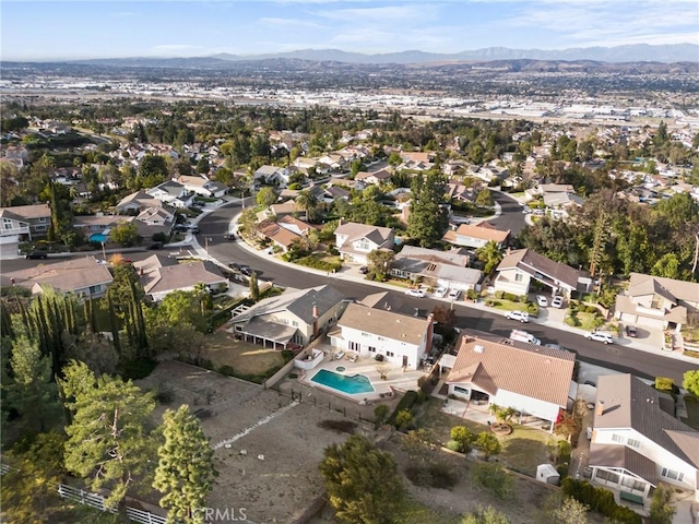 birds eye view of property featuring a mountain view