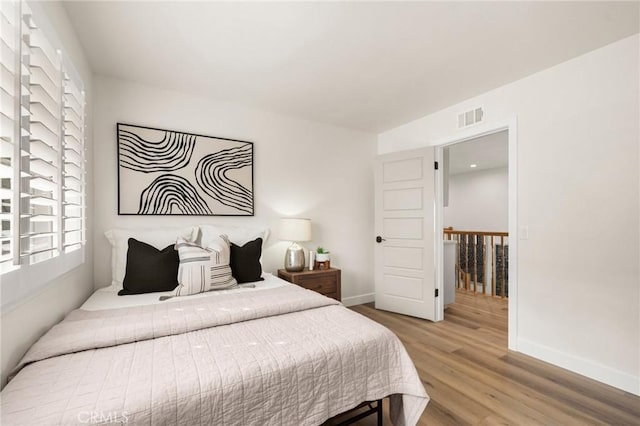 bedroom featuring hardwood / wood-style flooring