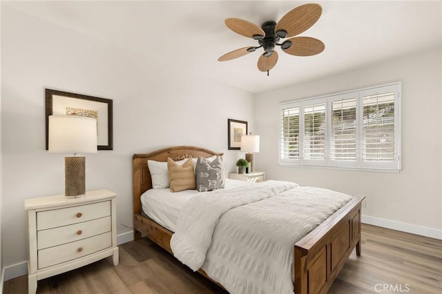 bedroom featuring hardwood / wood-style flooring and ceiling fan