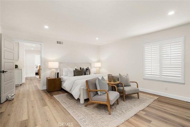 bedroom with light wood-type flooring