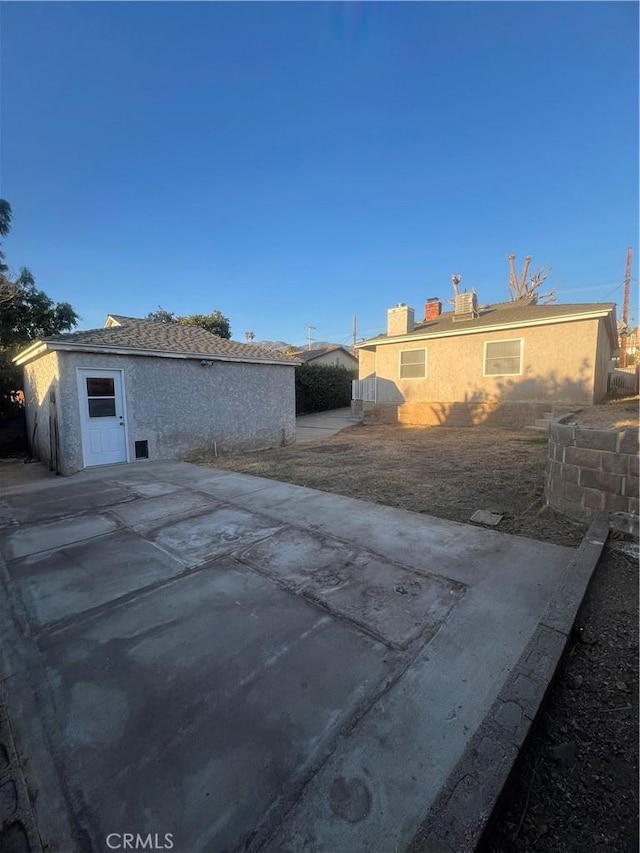 view of property exterior with a patio and stucco siding