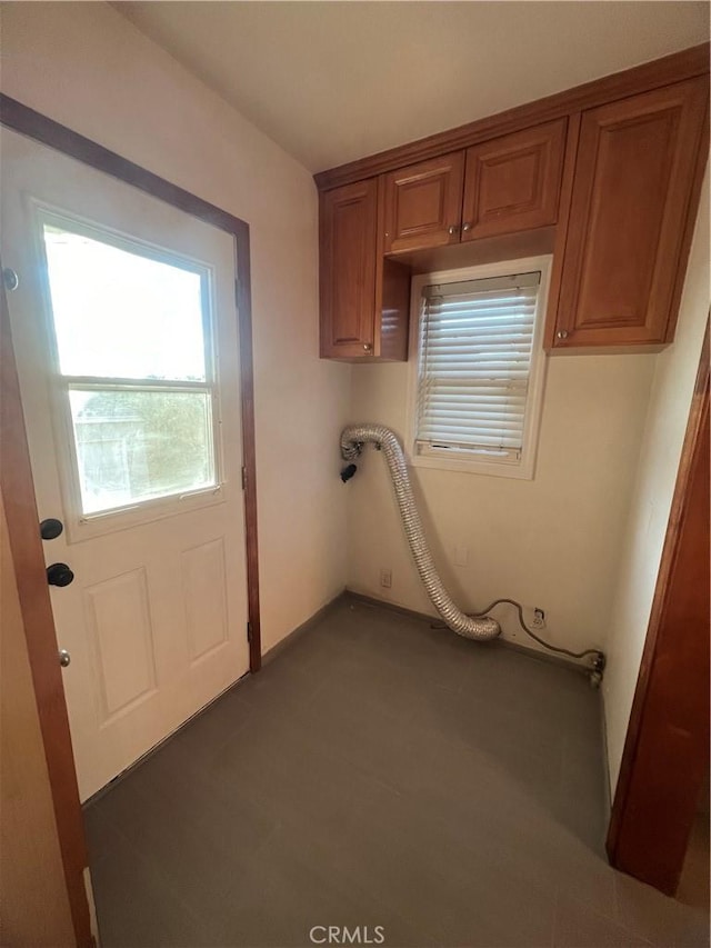 washroom featuring baseboards and laundry area
