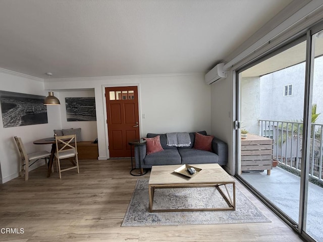 living room with hardwood / wood-style floors, crown molding, and a wall mounted air conditioner