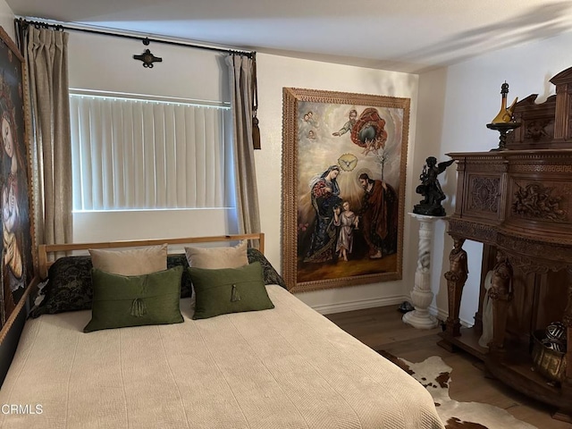 bedroom featuring wood-type flooring