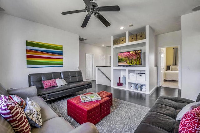 living room featuring ceiling fan and built in features