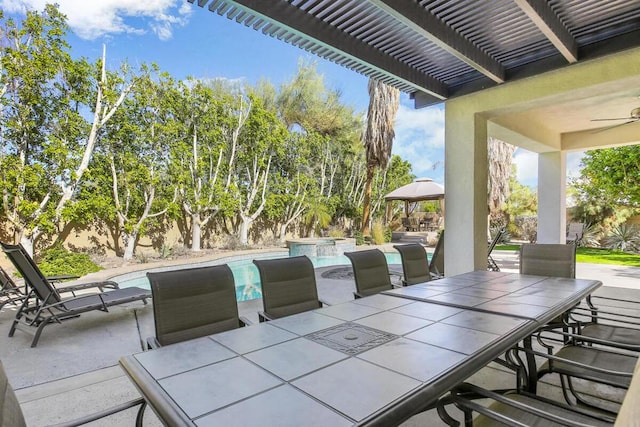 view of patio / terrace featuring ceiling fan