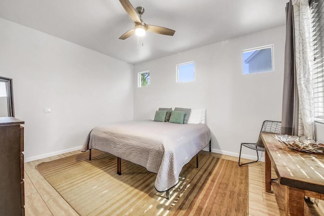 bedroom with ceiling fan and hardwood / wood-style flooring