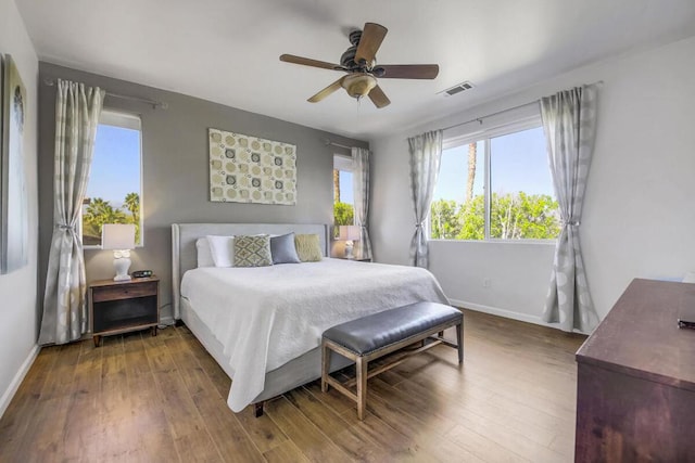 bedroom with ceiling fan and hardwood / wood-style floors