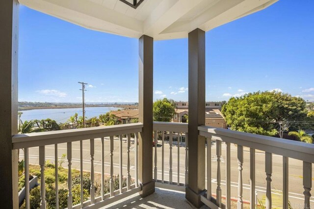 balcony featuring a water view