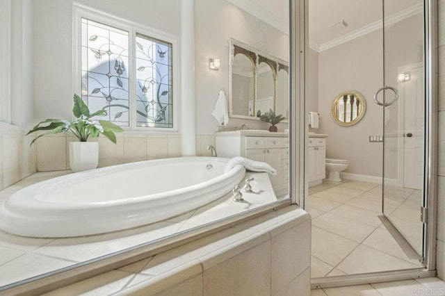 bathroom featuring toilet, vanity, tile patterned flooring, tiled tub, and ornamental molding