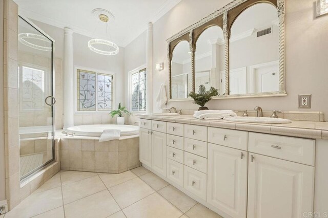 bathroom featuring tile patterned floors, vanity, ornamental molding, and shower with separate bathtub