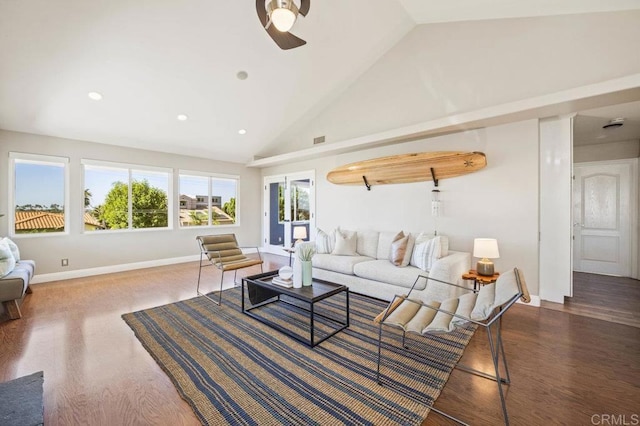 living room with vaulted ceiling, ceiling fan, and dark wood-type flooring