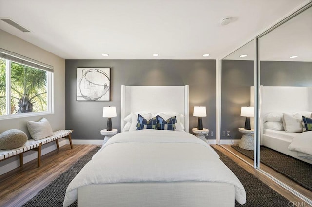 bedroom featuring dark wood-type flooring