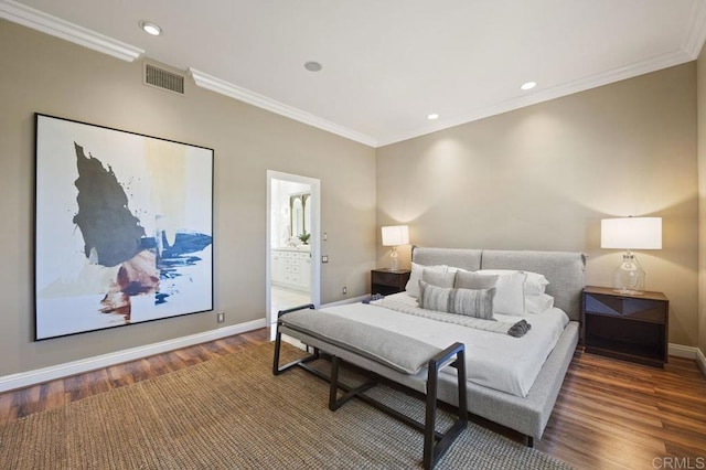 bedroom with dark wood-type flooring, connected bathroom, and ornamental molding