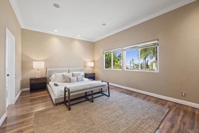 bedroom featuring wood-type flooring and crown molding