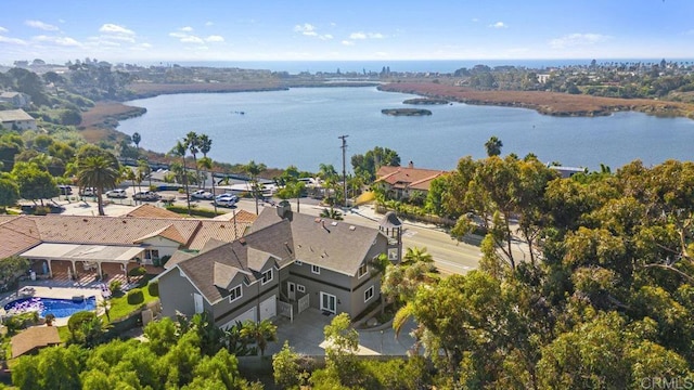 birds eye view of property featuring a water view