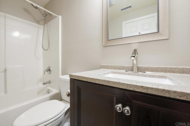 full bathroom featuring toilet, bathing tub / shower combination, and vanity