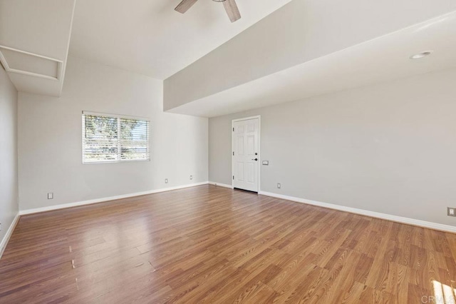 spare room with ceiling fan and hardwood / wood-style flooring