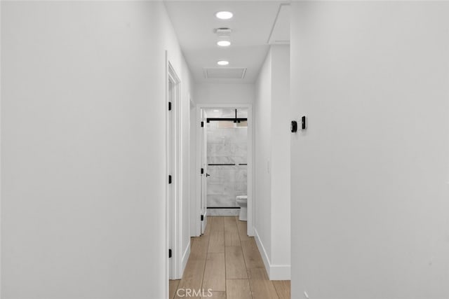 hallway with light wood-type flooring