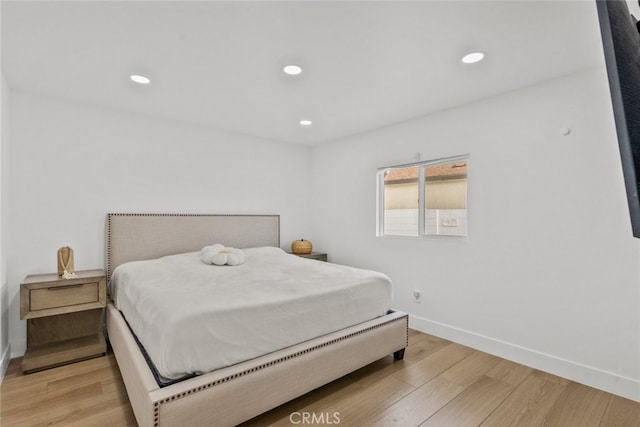 bedroom with light wood-type flooring