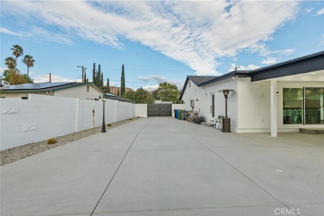 view of property exterior with a patio