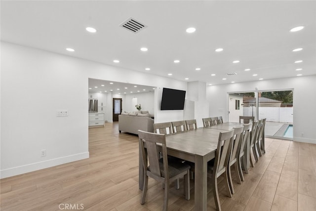 dining room featuring light hardwood / wood-style flooring