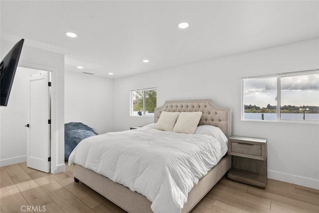 bedroom with light hardwood / wood-style floors