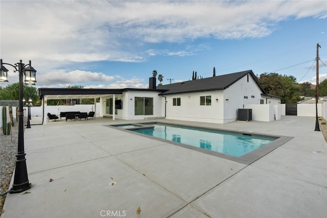 view of pool with a patio area and central AC