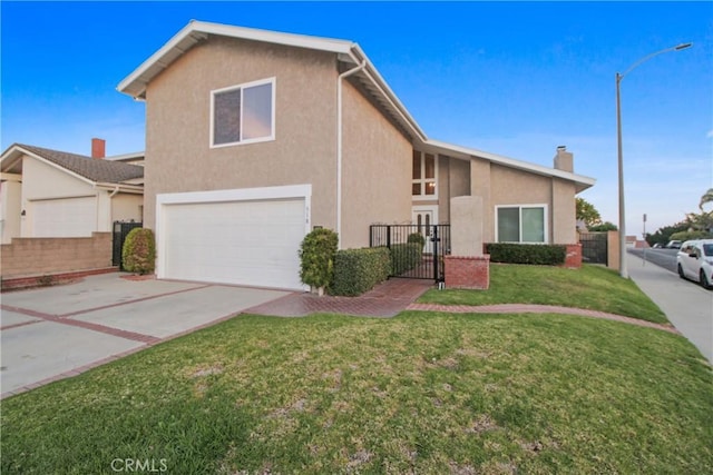 front of property with a front lawn and a garage